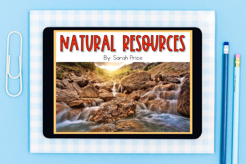Natural Resources Lesson Plans Kids Will Love Natural resources lesson plans showing a Google Slides digital activity on a tablet with a mountain waterfall scene, placed on a blue gingham notebook with a paper clip and pencils.