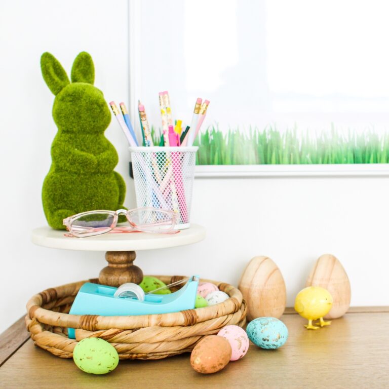 This is a picture of a teacher's desk decorated with Easter eggs and a grass bunny.